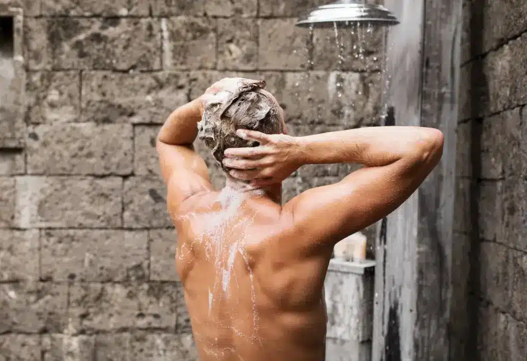 Man Taking a Shower Chemical-free Shampoo