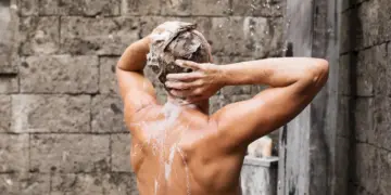 Man Taking a Shower Chemical-free Shampoo