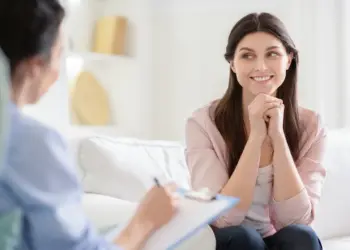 Smiling Woman Talking to Wellness Coach