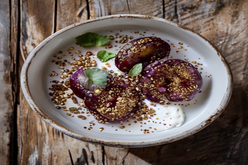 Quinoa breakfast bowl with roasted plums